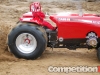 Large-scale tractor making a pass