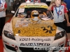 Pay a buck, sign the hood of the car